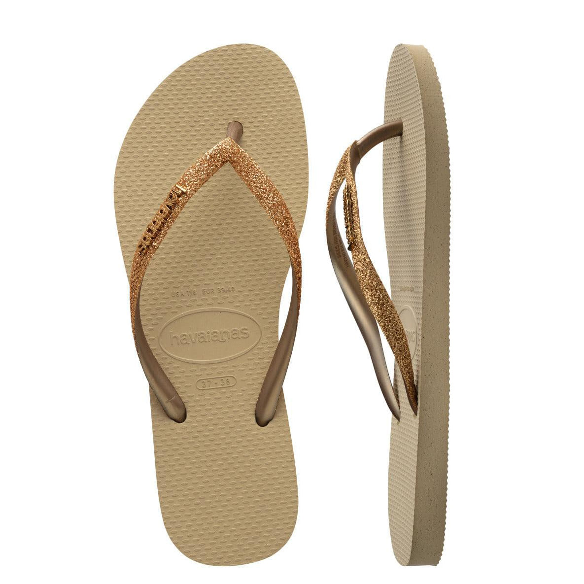 Chinelo Havaianas Slim Glitter II cor areia apresentado em vista superior e lateral, tiras finas com glitter bronze/dourado e solado texturizado em borracha.